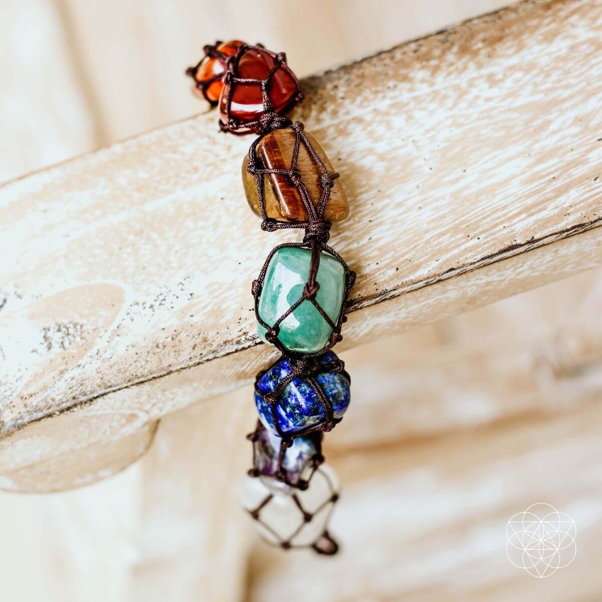 Tassel with colorful stones on a wooden surface