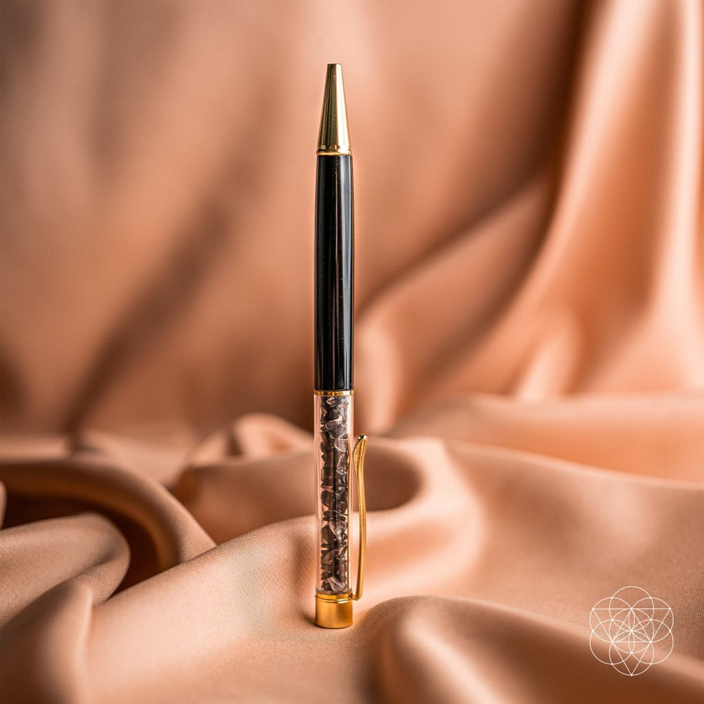 Luxury pen with black and gold accents on a draped fabric background